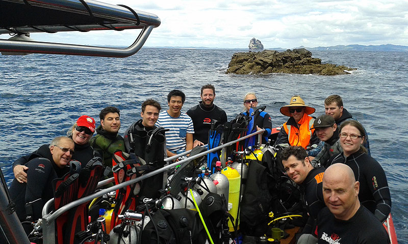 Taking a break at Taranga Island with Sail Rock behind in the distance.